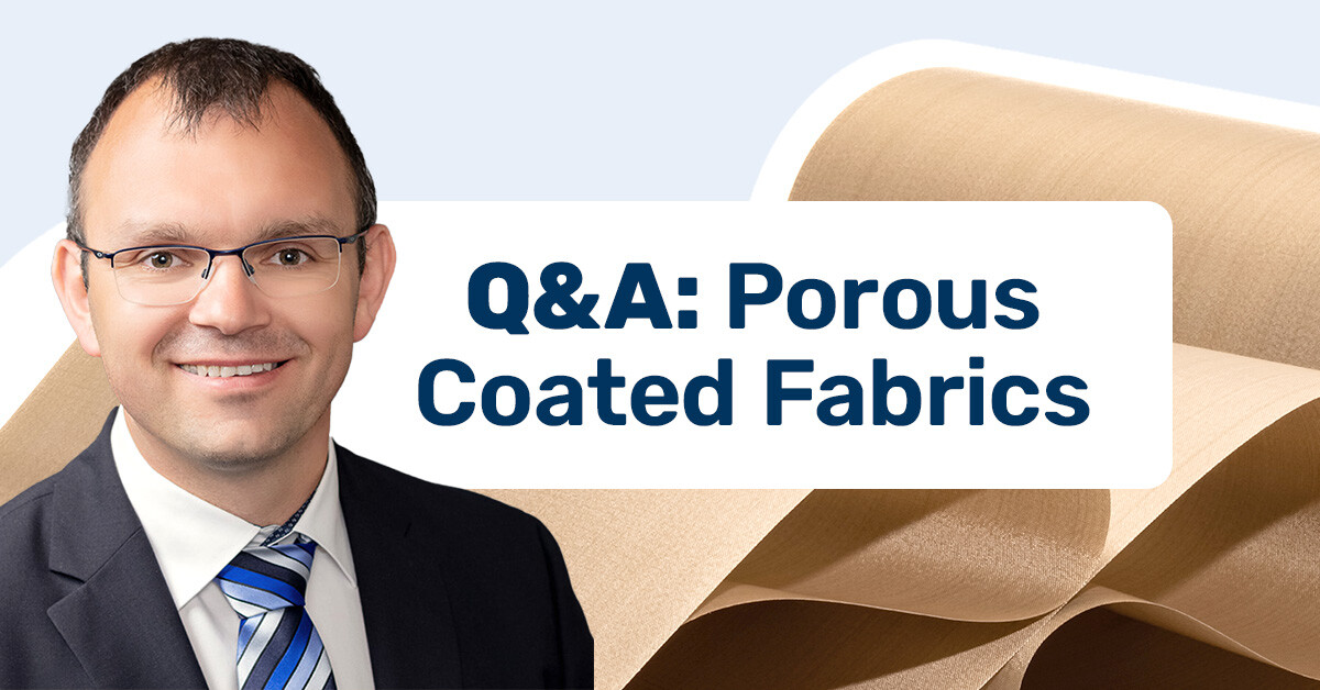 Michael Katzer in front of "Q&A: Porous Coated Fabrics"; in the background, a roll of Versiv PTFE-Coated Porous material