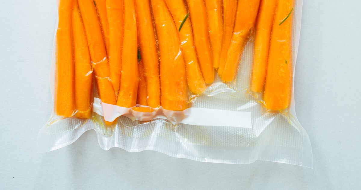 Carrots in vacuum package, sealed by heat welding.