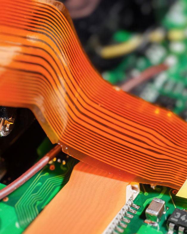 Versiv PTFE-coated fabrics minimise defects, improve yield, and ensure consistent quality in Flexible Printed Circuit Boards (FPCB) coverlay lamination.