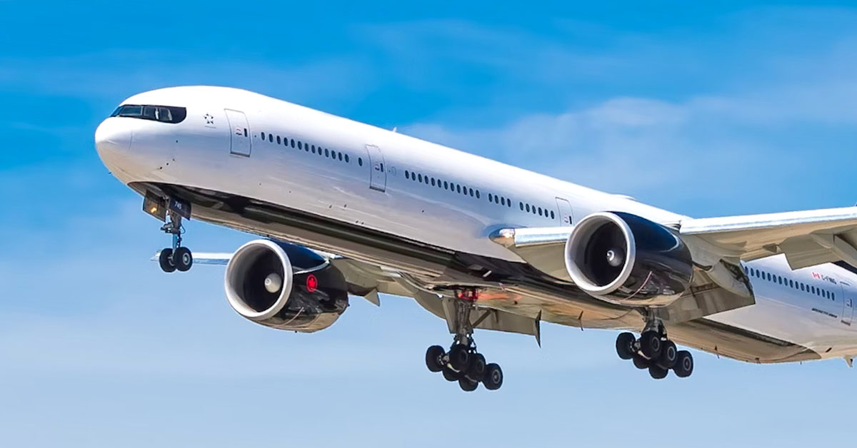 Airplane flying against blue sky