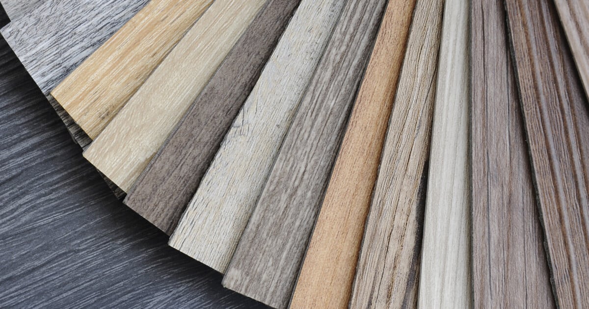 Sheets of different Luxury Vinyl Tiles, resembling wood. 